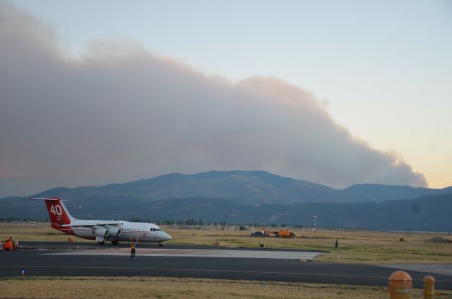 British Aerospace BAe-146-200 (N146FF) - Tanker 40 returns to KMSO for the night, with the Lolo complex fire smoke plume in the background.