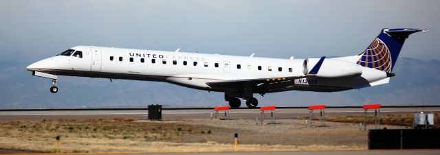 Embraer EMB-145XR (N13124) - Landing on 16L.