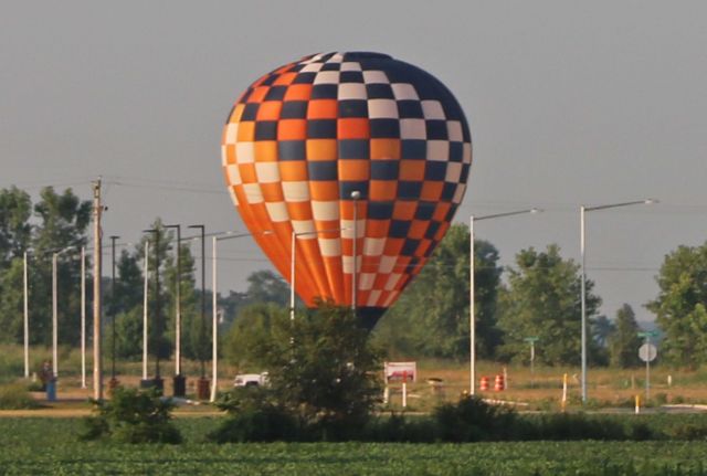 Unknown/Generic Balloon (N220LB) - N220LB, a Lindstrand 77A (Renegade), just before liftoff as seen while passing through Rossford, OH looking south from the Ohio Turnpike (near mile marker 65) on Sunday morning, 15 Jul 2018. A total of nineteen balloons competed in the 3rd annual Glass City Balloon Race in Rossford, OH.