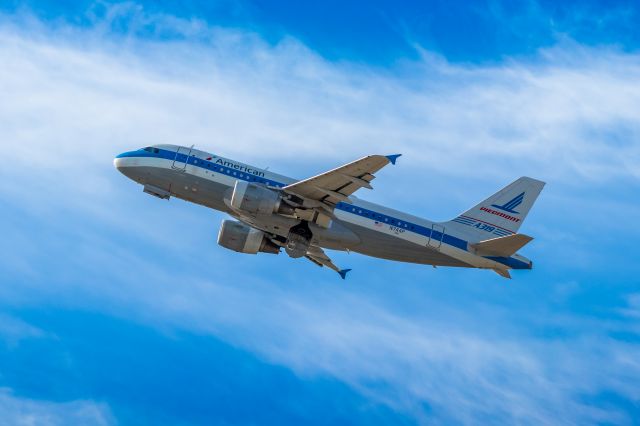 Airbus A319 (N744P) - American Airlines A319 in Piedmont retro livery taking off from PHX on 9/28/22. Taken with a Canon 850D and Rokinon 135mm f/2 manual focus lens.