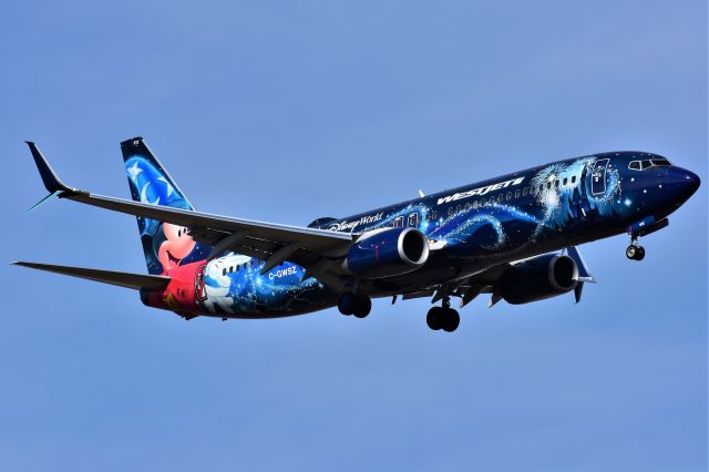 Boeing 737-800 (C-GWSZ) - WestJet (Disney's Micky Mouse Livery) WestJet (Disney's Micky Mouse Livery) arriving at YYC on May 11.