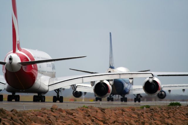 Airbus A380-800 (VH-OQA) - Qantas A380 following a United 747 to runway 34L