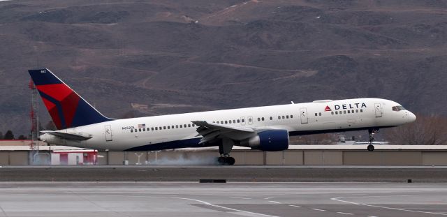 Boeing 757-200 (N652DL) - The Las Vegas Golden Knights charter touches down on 16R at RNO as the Golden Knights arrive to participate in the "NHL Outdoors at Lake Tahoe" event at Edgewood in Stateline, Nevada.   