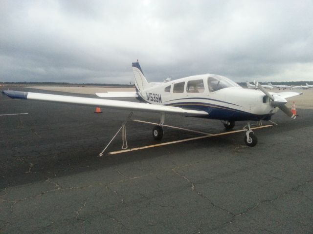 Piper Cherokee (N153SM) - FL Aviation Center's Piper Warrior on an overcast day.