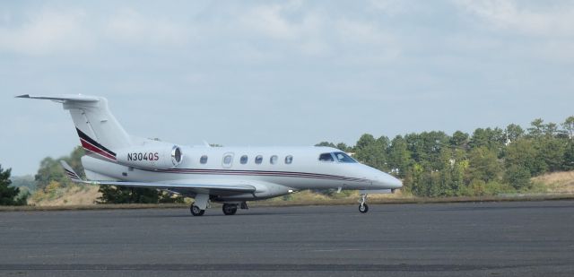Embraer Phenom 300 (N304QS) - Taxiing for departure is this 2013 Embraer Phenom 300 from the Summer of 2024.