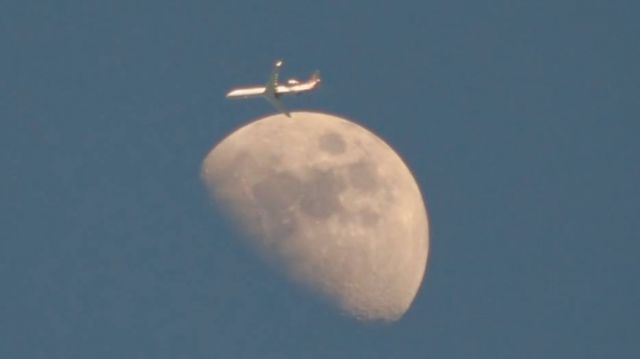 — — - Was trying to get approaching aircraft into EWR at 6000 but couldnt get the right angle with the moon. This departure from PHL was probably at FL200 when it passed but it was at a good angle. 