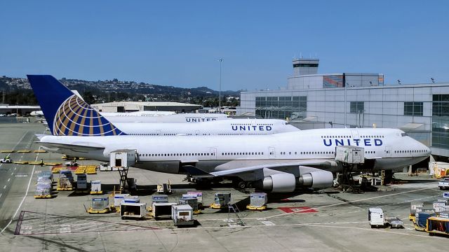 Boeing 747-400 — - 3 United 747s and an Air China 747 viewed from the SFO BART station