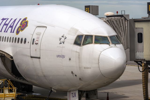 Boeing 777-200 (HS-TJV) - 5th June., 2022: Flight TG 321 waiting at Gate F5 at Bangkok's Suvarnabhumi International Airport for departure to Zia International Airport in Dhaka. 