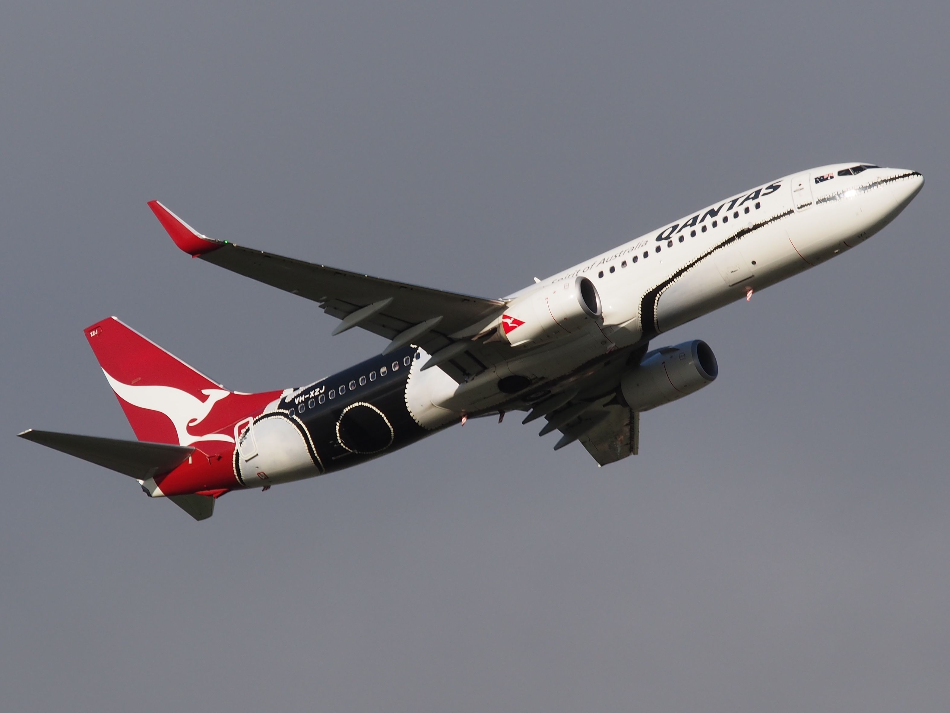 Boeing 737-700 (VH-XZJ) - Taking off from runway 23, Adelaide International Airport. Photo taken from Tapleys Hill Road viewing area.