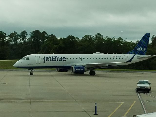 Embraer ERJ-190 (N229JB) - Took this pic of JetBlue Embraer 190, under the name "Blue Amigo", as it taixed to the gate, in which would fly me home to DCA.