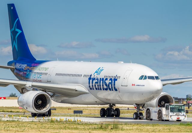 Airbus A330-200 (C-GITS) - Ship #201 being towed to the maintenance hangars at the north end of YYZ. This was the bird that made the glider landing in the Azores.