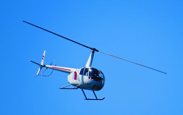 Robinson R-44 (C-FJLH) - filming the rowing competition of the Canada Summer Games 2013 on Magog Lake near Sherbrooke, Québec