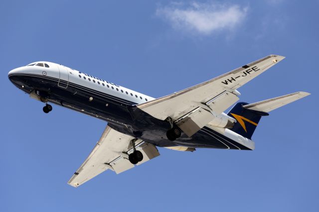 Fokker 70 (VH-JFE) - On approach to Townsville Airport. The Airlines livery is normally all white except for the tail and titles as you see it now, must be a recent addition.