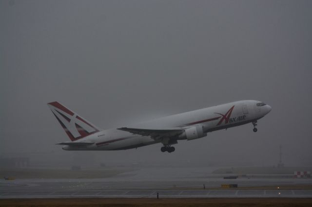 BOEING 767-200 (N744AX) - A battered and old 762 rotating off 36R producing some nice vortices and condensations in low vis.