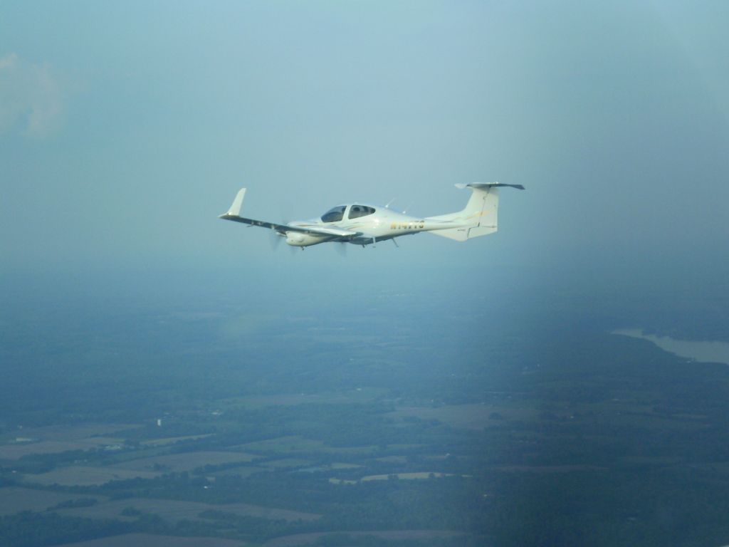 Diamond Twin Star (N147TS) - 2006 DA-42 TwinStar G100    www.huntsvilleflightcenter.com  Flight over Wheeler Lake, AL  Huntsville Flight Center Training and Rental Aircraft   1-256-461-1448