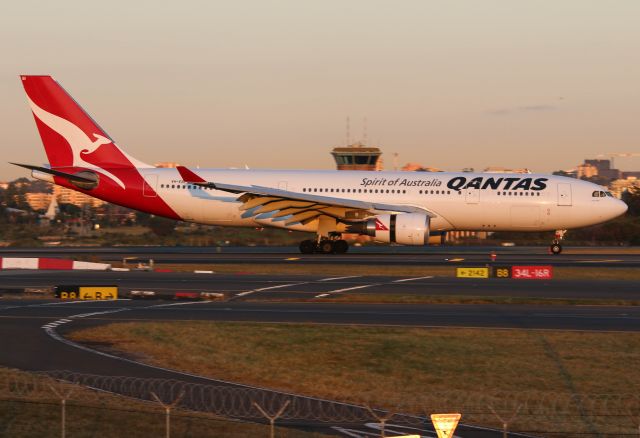 Airbus A330-200 (VH-EBI) - VH-EBI Arrives on 34L at dawn. Love this light! Taken from The Mound 