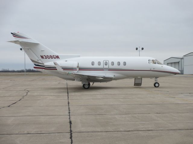 Hawker 800 (N308GW) - N308GW , a 2010 HAWKER BEECHCRAFT CORP HAWKER 900XP,awaiting passengers @ Joplin on 11 JAN 2015.