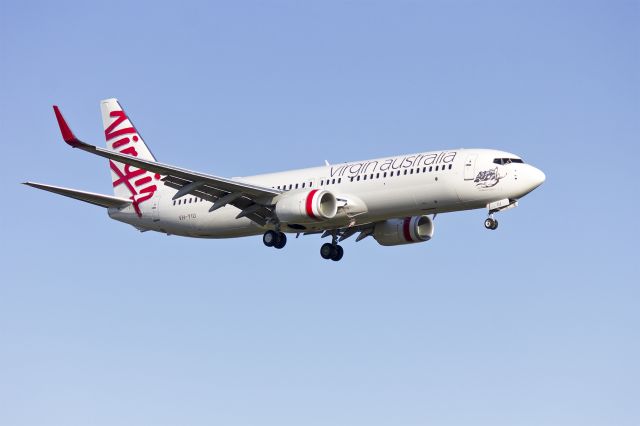 Boeing 737-700 (VH-YIU) - Virgin Australia (VH-YIU) Boeing 737-8FE(WL) on approach to runway 25 at Sydney Airport.