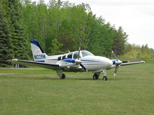 Beechcraft Baron (58) (N122RM) - Leaving Breezy Point Resort(8MN3) - Pequot Lakes, MN