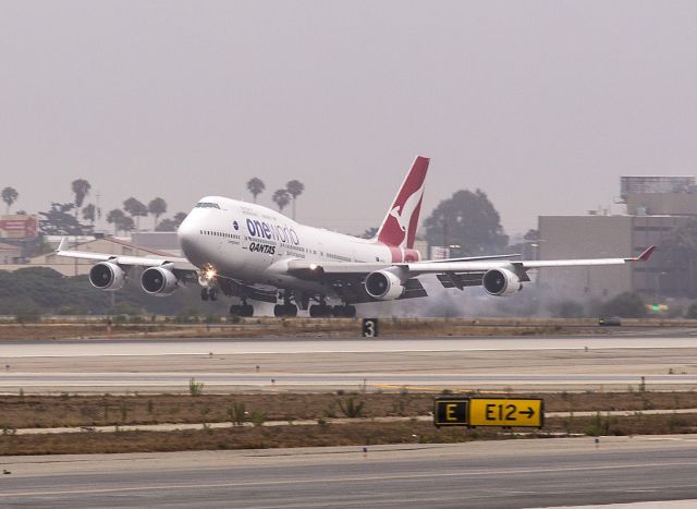 Boeing 747-200 (VH-OEF) - Watch for Kangaroos  This big Qantas 747 is landing at Los Angeles International Airport (LAX) on runway 24L. It was a gray, early morning arrival.