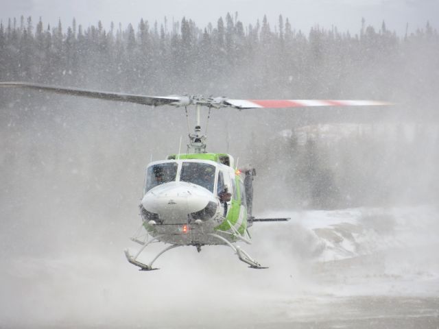 Bell BigLifter (C-GFIT) - C-GFIT, An Heli-Excel Bell 214 arriving from a telecommunication site in a snow shower. Poste-Montagnais, Québec - November 2012