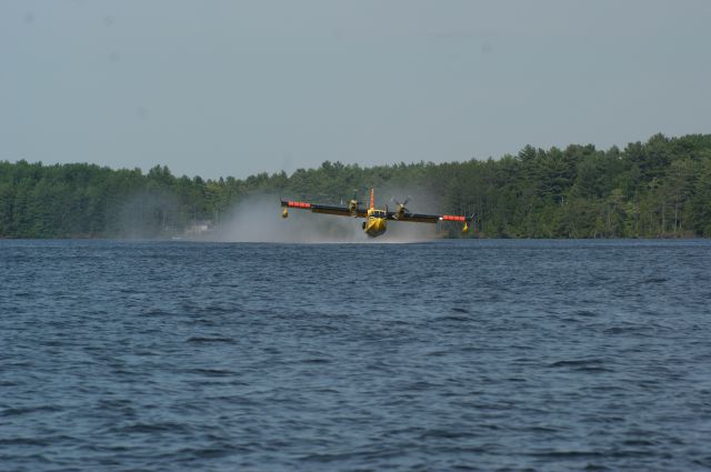 Canadair CL-41 Tutor (C-GOGW) - Crystal Lake, Ontario taken from our boat we had an awesome view as two SuperScoopers fought a nearby forest fire we could not see.