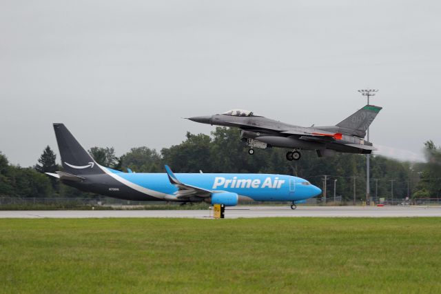 Boeing 737-800 (N7901A) - Amazon Prime Air (Sun Country Airlines) taxiing out for departure as a USAF F-16, 90-0731, departs RWY 7 on 16 Aug 2021.