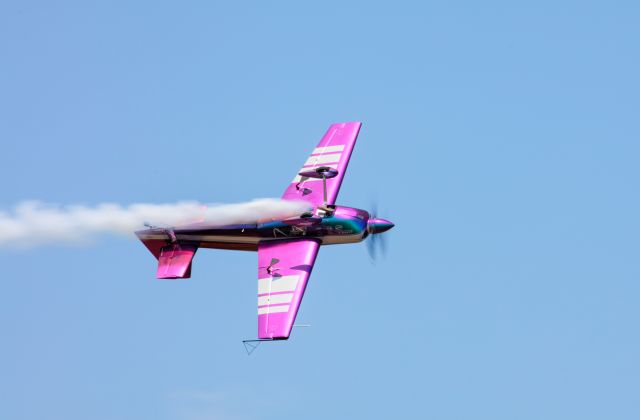 ZIVKO Edge 540 (N540WS) - Bill Stein performing his aerobatic maneuvers at the Battle Creek Airshow on July 3rd, 2017. In this shot I was able to capture a cool action shot of bill flying upside down. Nailed the focus on this one! For best viewing experience, please click on "FULL" to see best resolution quality of photo. Keep in mind this is a 2MP downsampled from the original 50MP raw.