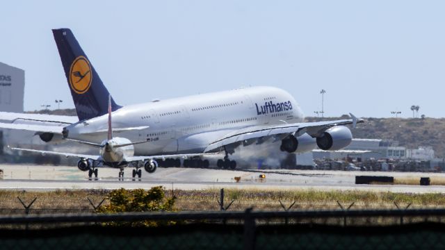 Airbus A380-800 (D-AIMA) - Heres a show off! Look at that little one holding short, looking on at awesome show of power! Oh, and that little one isnt too little. Its a 737 I fly across US in.