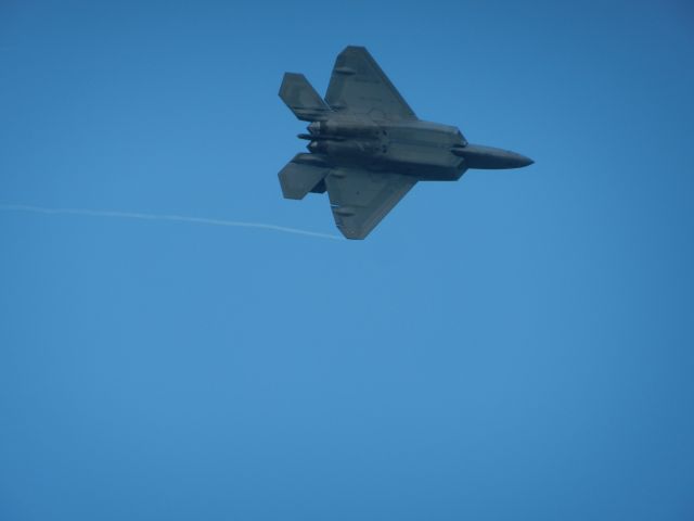 Lockheed F-22 Raptor — - An F-22 Raptor Does A Turn With Vapor On Its Left Wingtip