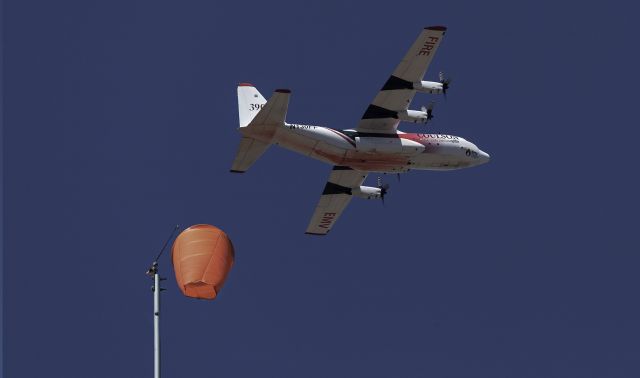 Lockheed C-130 Hercules (N130FF) - Taken From My Back yard which I actualy have a wind sock