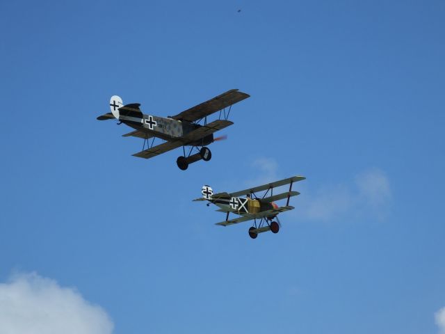 — — - Fokker DVII Albatross and Fokker DR.I Triplane on 25 Jan 2014, practice day for Tauranga Airshow.