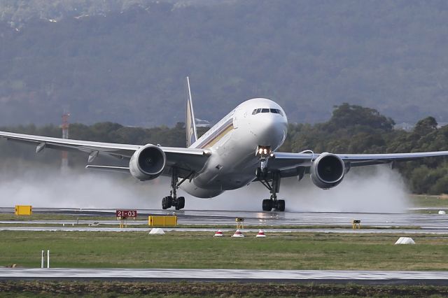 Boeing 777-200 (9M-SQM) - Taking off from a wet runway in Perth, Western Australia