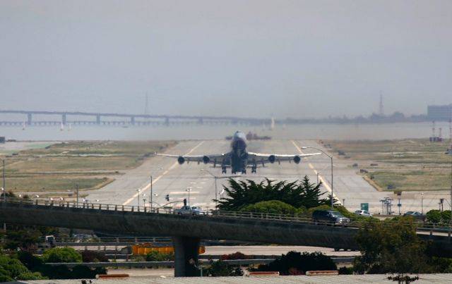 Boeing 747-400 — - KSFO - crummy photo but looked neat at the time...UAL 747 lifting off 28R for points west - 