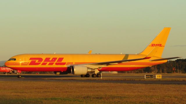 BOEING 767-300 (VH-EXZ) - A late evening arrival with the 'Jaffajet' in the backdrop.