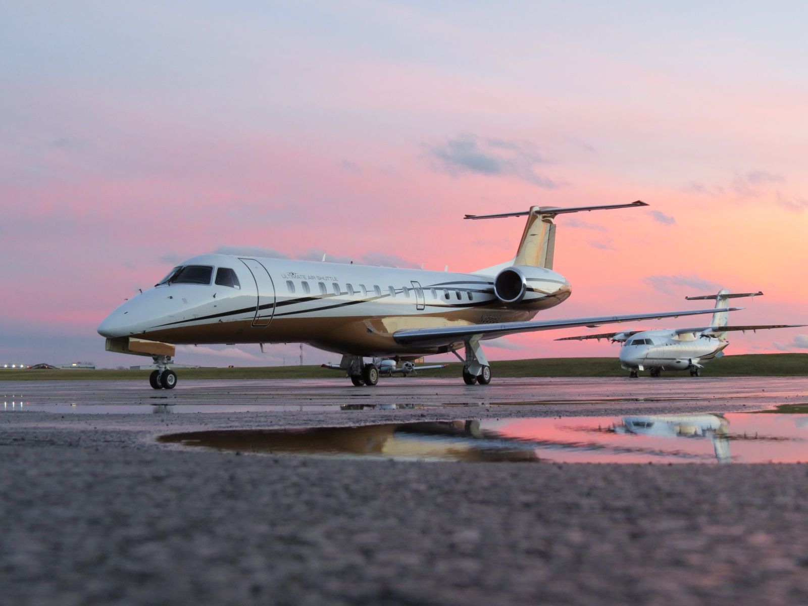 Embraer ERJ-135 (UJC56) - Ultimate Airs newest addition basks in a beautiful sunset here at KCAK. 