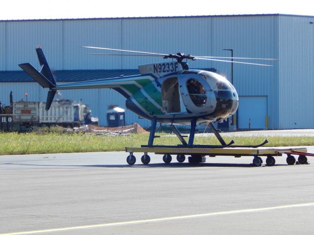 MD Helicopters MD 500 (N9233F) - N9233F, A 1975 Hughes 500, sits at KHEF getting ready for takeoff.