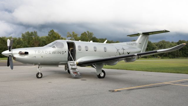 Pilatus PC-12 (N816TW) - N816TW parked on the ramp at College Park Airport with some nice background clouds 