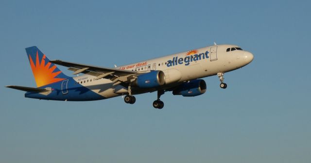 Airbus A320 (N215NV) - On short final is this 2000 allegiant Airbus 320-214 from the Spring of 2022. Setting sun angle shows the wing shadow. 