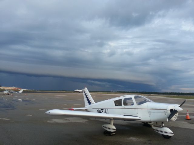 Piper Cherokee (N4211J) - Weather moving unto the field.