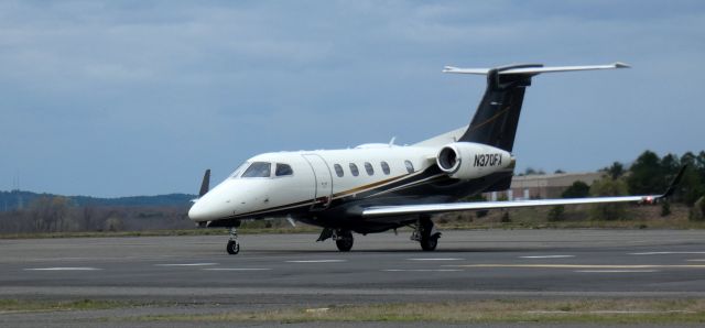 Embraer Phenom 300 (N370FX) - Taxiing to parking is this 2016 Embraer Phenom 300 in the Spring of 2024.