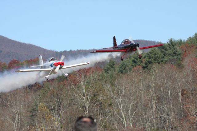 — — - Coming out of the mountains these two experimental aircraft were putting on a good show