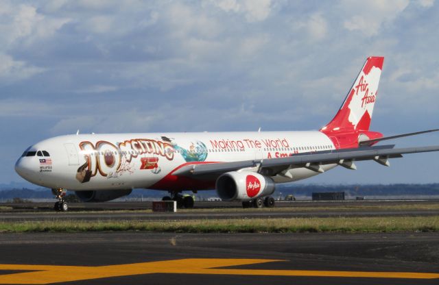 Airbus A330-300 (9M-XXF) - One of AirAsia X's seemingly endless special schemes arriving at Auckland Airport.