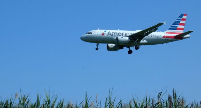 Airbus A319 (N772FX) - About to touch down is this 2003 American Airlines Airbus 319-112 in the Summer of 2023.
