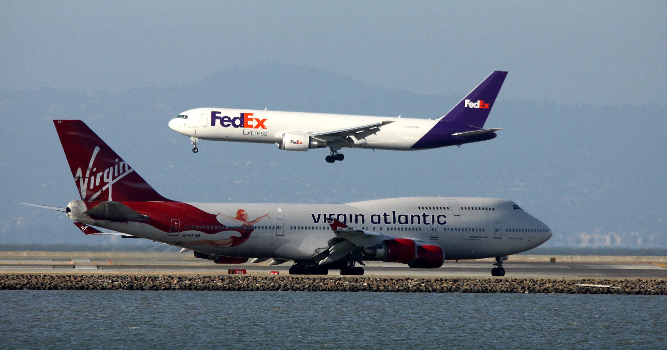 BOEING 767-300 (N109FE) - FedEx arrival 28L, from MEM as Virgin Atlantic # 20 (B744) awaiting departure to LHR from 28 L 