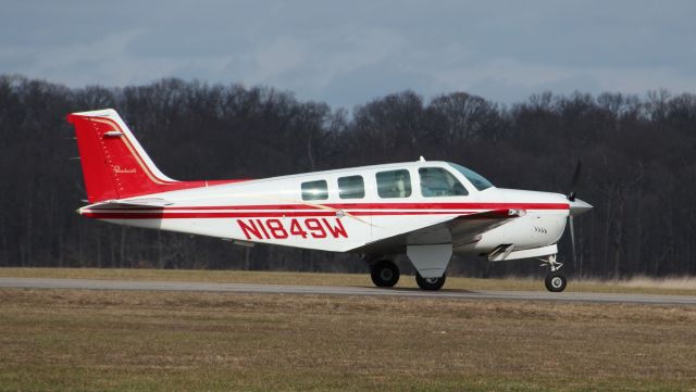 Beechcraft Bonanza (36) (N1849W) - Taxiing out for departure rwy 27 on 12/28/11