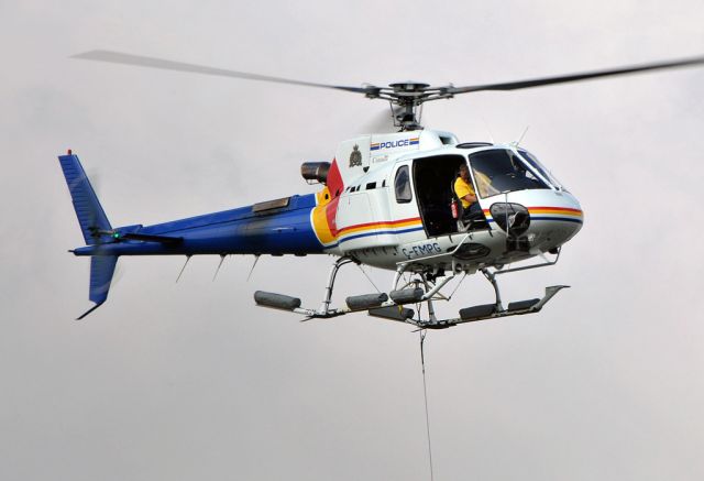 Eurocopter AS-350 AStar (C-FMPG) - This police helicopter pilot is practising dropping the sling into a barrel