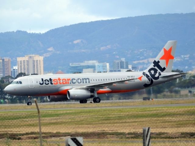 Airbus A320 (VH-VGJ) - On taxi-way heading for Terminal 1 after landing on runway 23. Tuesday 27th December 2011.