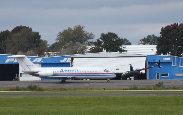 Robinson R-44 (N440CS) - Departing In front of the Ameristar DC9 is a 2008 Robinson R44 Helicopter in the Autumn of 2018.