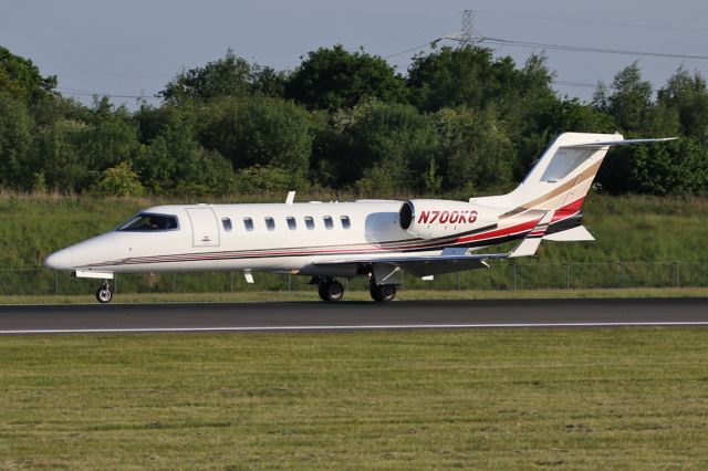 Learjet 45 (N700KG) - A regular visitor to Manchester, N700KG slows in the evening sun on 05R